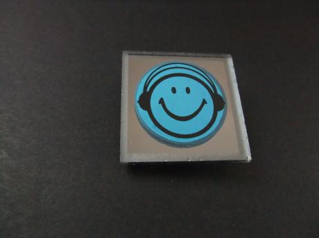 Acid House ( muziekstroming jaren 80) Smiley met koptelefoon